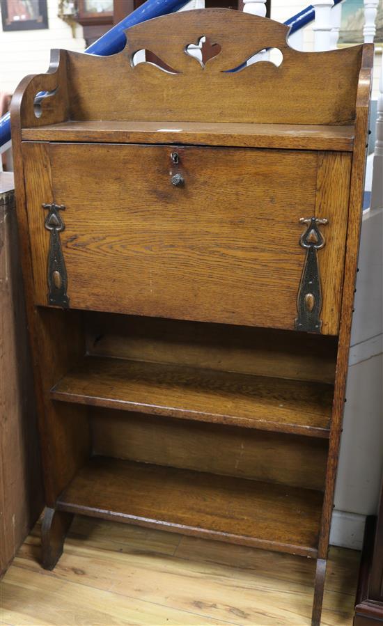 An oak Arts and Crafts students bureau W.65cm